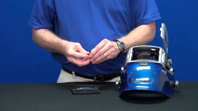 how to change battery in miller welding helmet